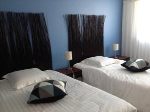 Katil atau katil-katil dalam bilik di Fettolina Palm Beach, Location Cannes front de mer et plage