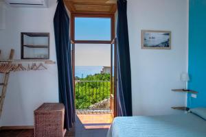 Postel nebo postele na pokoji v ubytování La Casa sul Blu Albergo Diffuso