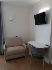 TV a/nebo společenská místnost v ubytování Hotel B&B Fortuna