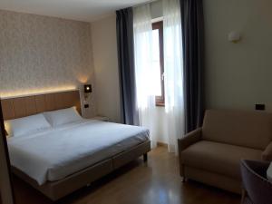 Postel nebo postele na pokoji v ubytování Hotel B&B Fortuna
