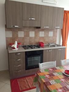 A kitchen or kitchenette at Attico Rosa