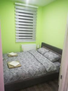 Posteľ alebo postele v izbe v ubytovaní Apartman HEDONIJA