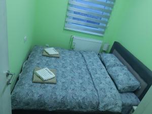 Ліжко або ліжка в номері Apartman HEDONIJA