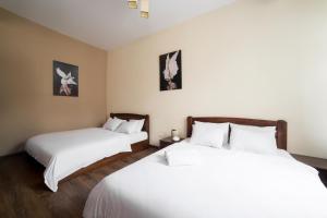 Postel nebo postele na pokoji v ubytování Aparthotel Na Mytniy