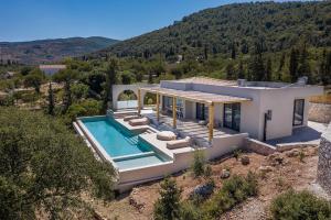 an aerial view of a house with a swimming pool at URANOS di GIOIA Villa with magnificent sea view and infinity pool 18x4m in Zakynthos