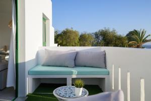a bench on a balcony with a table at Buenavista Ocean View in Puerto del Carmen