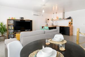 a living room with a couch and a table at Buenavista Ocean View in Puerto del Carmen
