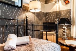 Posteľ alebo postele v izbe v ubytovaní Aparthotel Oberża