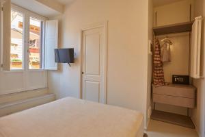 Postel nebo postele na pokoji v ubytování Ripagrande a Trastevere