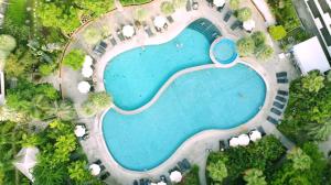 an overhead view of a swimming pool at a resort at Wongamat Privacy Residence, Pattaya in Pattaya North