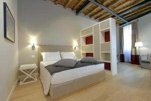 A bed or beds in a room at Monti Panisperna suites