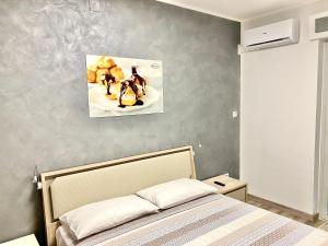 Voodi või voodid majutusasutuse Siclari B&B-Rooms&Suite toas