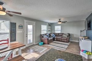 a living room with a couch and a table at 2 Blocks to Gulf Surfside Beach Family Home! in Surfside Beach