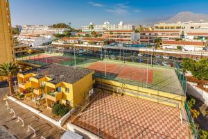 an overhead view of a tennis court in a city at PLAYA LAS VISTAS LOFT in Los Cristianos