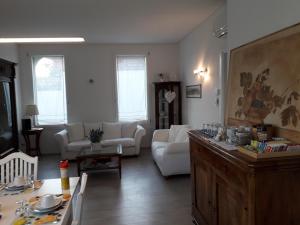 a living room filled with furniture and a window at Dafne B&B in Treviso
