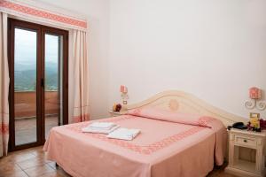 Postel nebo postele na pokoji v ubytování Hotel Montiruju