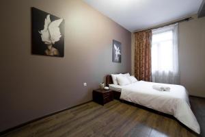 Postel nebo postele na pokoji v ubytování Aparthotel Na Mytniy