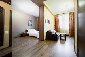 Postel nebo postele na pokoji v ubytování Aparthotel Na Mytniy
