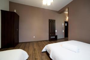 Postel nebo postele na pokoji v ubytování Aparthotel Na Mytniy