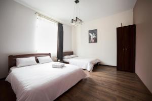 Postel nebo postele na pokoji v ubytování Aparthotel Na Mytniy