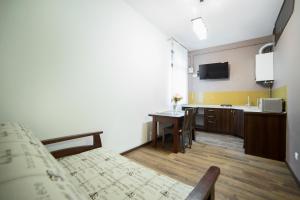 TV a/nebo společenská místnost v ubytování Aparthotel Na Mytniy