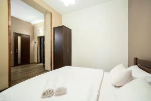 Postel nebo postele na pokoji v ubytování Aparthotel Na Mytniy