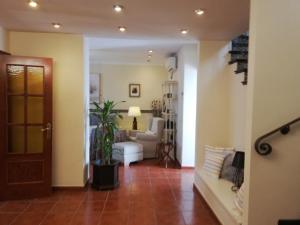 a living room with a couch and a table at Casa Candela in Ronda