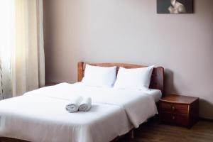 Postel nebo postele na pokoji v ubytování Aparthotel Na Mytniy