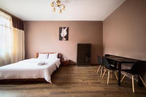 Postel nebo postele na pokoji v ubytování Aparthotel Na Mytniy