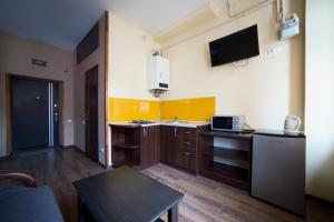 Kuchyň nebo kuchyňský kout v ubytování Aparthotel Na Mytniy