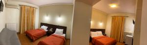 A bed or beds in a room at Ξενοδοχείο Acropol