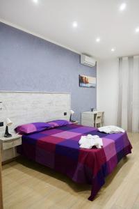 Posteľ alebo postele v izbe v ubytovaní b&b annunziata dream