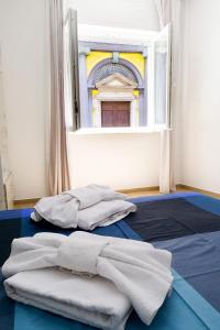 Posteľ alebo postele v izbe v ubytovaní b&b annunziata dream