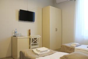 TV a/nebo společenská místnost v ubytování Hotel Casa calda