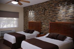 Säng eller sängar i ett rum på Hotel Posada Santa Fe
