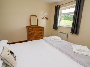 Llit o llits en una habitació de Red Kite Cottage