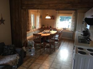 a kitchen with a table and chairs in a room at Gut Schablberg in Radstadt