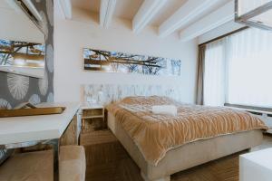Ένα ή περισσότερα κρεβάτια σε δωμάτιο στο Medical and Spa Centre Merkur