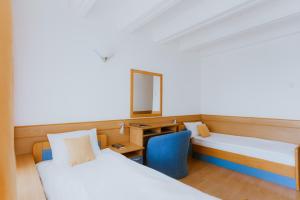 Ένα ή περισσότερα κρεβάτια σε δωμάτιο στο Medical and Spa Centre Merkur