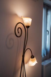 a lamp that is sitting next to a wall at Luxury Apartment in Plaka - Acropolis (Rosemary) in Athens