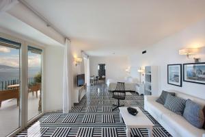 a living room with a couch and a table at Hotel Bristol in Sorrento