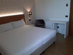 Postel nebo postele na pokoji v ubytování Hotel B&B Fortuna