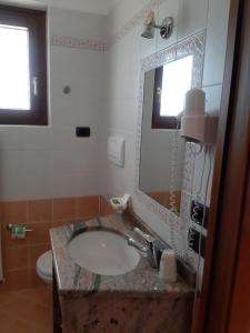 Koupelna v ubytování Hotel B&B Fortuna