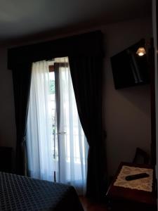 TV a/nebo společenská místnost v ubytování Hotel B&B Fortuna