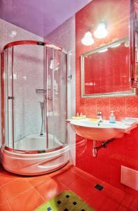 a bathroom with a shower and a sink at Rosa Del Viento Hotel in Tuapse