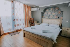 מיטה או מיטות בחדר ב-Orbi Residence Hotel Official