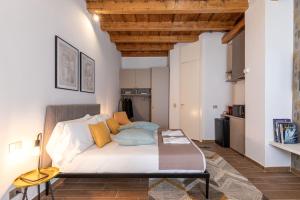 a bedroom with a bed in a room at BePlace Apartments in Magenta in Milan