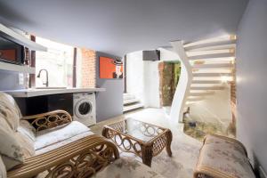 a living room with a couch and a table at Апартаменти з сауною на Площі Ринок для 4 -х гостей - в еко стилі in Lviv