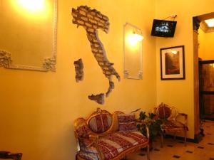 TV a/nebo společenská místnost v ubytování Cambridge Hotel