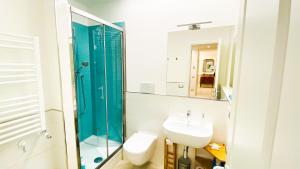 a bathroom with a sink and a toilet and a mirror at Trastevere Boulevard in Rome